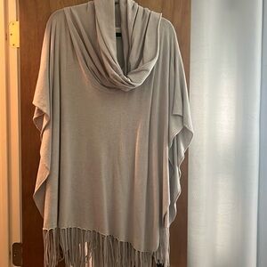 Cowl neck poncho sweater with fringe